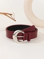 Close-up of red crocodile pattern belt with silver crescent buckle in soft lighting - Stone Pattern Wine Red