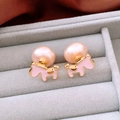 Close-up of pink pony stud earrings with pearls on gray velvet jewelry display - Pink Horse (S925 Pin Gold Plated)
