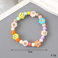 Colorful beaded bracelet with smiley flower beads in yellow pink and blue 5cm inner diameter - Clay Smile Style (K3348)