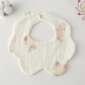 Detail of petal-shaped cotton baby bib with bear print and snap button closure - Gauze Flower Scarf - Baby Bear