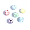 Macro shot of colorful acrylic volleyball beads with central holes for DIY jewelry - White+Colorful Volleyball