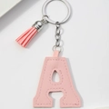 Pink PU leather letter A keychain with matching tassel and silver metal ring on white background - Pink-Letter A