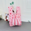 Pink knitted tote bag featuring red pumpkin pattern and polka dots for daily commute - Pumpkin Pink