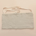 Close-up of beige cotton muslin baby bedside organizer with detailed fabric texture - Khaki