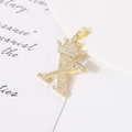 Macro shot of gold-plated letter K pendant with crown and sparkling zircon stones - Letter X