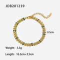 Detail view of 18K gold stainless steel bracelet with green leaf charms and size specs - Gold (JDB201239)