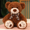Dark brown teddy bear plush toy with blue plaid bowtie and embroidered heart paw detail - Red Brown