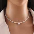 Shell letter W beaded necklace with white crystals and gold heart bead on model neck - Letter W