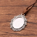 Antique silver oval pendant base with flower edges on a brown PU cord necklace - Flower Pattern Border Oval Style