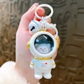 Portachiavi orsetto astronauta con dettagli dorati, campanellino bianco e gancio - Astronauta Luminoso - Orso Dorato