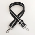 Close-up of black nylon strap with white arrow pattern and silver metal buckle - Black Silver Thread + Silver Buckle