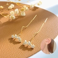 Elegant gold long chain star earrings with sparkling white zircons for women - Golden Triple Star Drop Earrings (KC Gold N-374)