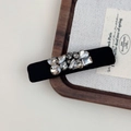 Dettaglio del fermaglio per capelli vintage nero con strass brillanti e design elegante - Fermaglio BB Stretto