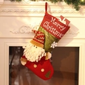 Festive red and green Christmas stocking with 3D Santa Claus figure on white fireplace - Extra Large Big Head Santa Sock