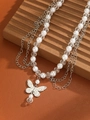 Layered butterfly pendant necklace with silver chains, pearls, and faceted beads - Style 11 Silver Necklace