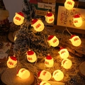 Christmas Santa Claus LED string lights with warm yellow glow on a miniature snow scene - Santa Claus / 1.5m 10LED Battery