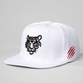 Macro detail of the tiger head embroidery and red claw marks on a white snapback cap - Adjustable / White