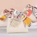 Triangle faux leather wedding favor bags in beige with colorful decorative silk ribbons - White