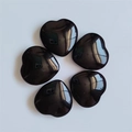 Set of five polished black obsidian heart stones arranged on a clean white background - Black Glass