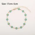 Blue daisy bracelet in gold finish with 17cm plus 5cm adjustable extension chain - Sky Blue Daisy (Gold Tone)
