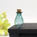 Mini oval glass wishing bottle in teal blue with a natural cork stopper for DIY crafts - Dark Green Oval Bottle With Cork