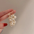 Close-up of elegant gold pearl bow earrings featuring multiple strands of white faux pearls - White Tassel (10# Ear Hook)