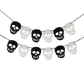 Halloween skull banner decoration featuring black and white paper skeleton head cutouts - Halloween Black & White Skull Banner