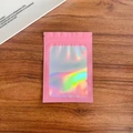 Pink holographic resealable jewelry storage bag on wooden desk with rainbow window - 10.5*15cm Pink