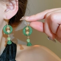 Classic lotus fan earrings with green jade pendant and butterfly tassel on model - Gold-Green Flower (17#)
