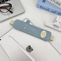 Detail of light blue denim pencil sleeve with pink butterfly embroidery and elastic band - Denim Light Blue