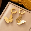 Elegant gold butterfly hoop earrings with brushed metal texture on a jewelry display - Textured Butterfly Earrings(AG3038) / Gold