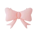 Detail of large matte pink bow foil balloon for party decoration on white background - Macaron Pink