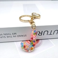 Detail of letter J resin keychain with colorful heart sequins and golden clasp - Letter J Lobster Clasp Keychain