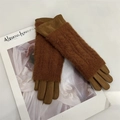 Detail of warm brown suede and knit plush gloves shown on a fashion magazine background - M / Camel