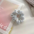 Light blue tulle scrunchie featuring a delicate daisy pattern for stylish ponytails - Small / Blue