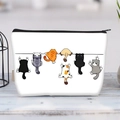 Large white canvas makeup bag featuring cute cartoon cats climbing a line with black zipper - Climbing Cartoon Cats(jiayingljb25)