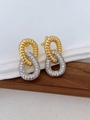 Detailed macro view of gold twisted ring interlocked with silver zircon paved hoop - White Zirconia Round Style (01)