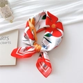 Elegant silk scarf with red and orange floral prints in a stylish bow presentation - Red Wood Flower / 70x70cm