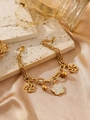 Detail of 18k gold flower bracelet with crystal petals on stone and silk background - Hollow Flower Style(ZHB1075 Gold)
