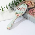 Cepillo de pelo verde claro con estampado floral y almohadilla de masaje - Azul Claro