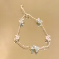 Vintage style butterfly bracelet with light blue and pink enamel in a gold finish - S699 Butterfly - Mint Blue Butterfly Pearl Bracelet