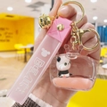 Pink floating panda acrylic keychain with liquid sand, silicone strap and gold bell - Pink Liquid + Panda