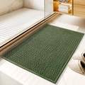 Thick green rectangular chenille bath mat with woven texture placed in a modern bathroom - Green