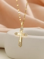 Macro shot of gold cross pendant with cubic zirconia inlay on a grey ceramic vase - Gold Multi-color Zirconia (4-Point Diamond)