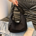 Versatile black nylon hobo bag with adjustable strap and woven zipper pull details - Black