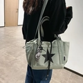 Mint green waterproof shoulder bag with black star print and checkered knot detail - Green With Knot