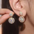 Floral double drop earrings with iridescent rhinestones shown on model and product view - Gold White AB
