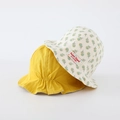 Dettaglio cappello sole neonato con lato giallo tinta unita e stampa a margherite colorate - 48cm / Giallo