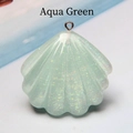Close-up of aqua green resin shell charm with sparkling glitter and silver metal ring - Aqua Green