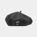 Close-up of a dark grey wool beret featuring detailed white coconut tree embroidery - Dark Heather Grey